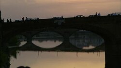 Traffic crosses Ponte Vecchio in Florence, Italy. Stock Footage