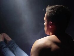 CU TS PAN Shot of Hunky topless man performing gymnastic display in bath / London, United Kingdom Stock Footage