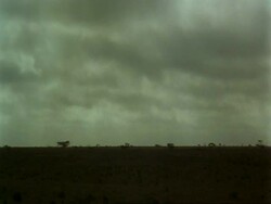 WA storm clouds moving right to left across frame, Jiddat al Harasis desert, Oman Stock Footage