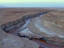   AERIAL WS TS View of muddy surface of dead sea in desert / Sourn Judea Desert, Israel  Stock Footage