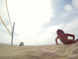 WS TS SLO MO  Woman diving for hitting  beach volleyball / Redondo Beach, California, United States Stock Footage