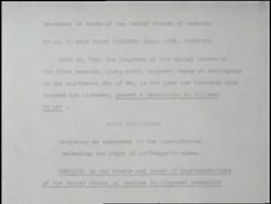 An official signs a document granting women the right to vote. News Clip