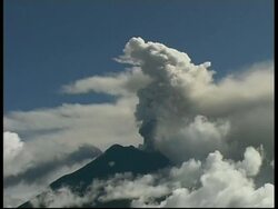 MS grey smoke and ash cloud billow from crater into sky, Mount Tunguragua, Ecuador Stock Footage