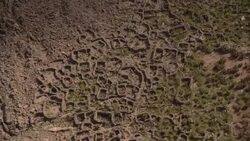 Mayan ruins sprawl across a dry plain in Peru. Stock Footage