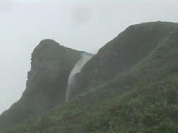 Typhoon winds. Flow of a waterfall reversed due to winds in excess of 200 kilometres per hour, during Super Typhoon Krosa, Taipei, Taiwan, 5th October 2007. Stock Footage