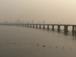 WS AERIAL View of city with bridge, smoke and buildings / Lagos, Nigeria Stock Footage