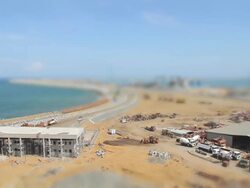 WS T/L View of excavators building new breakwater at Colombo Port / Colombo, Western Province, Sri Lanka Stock Footage