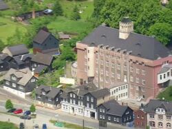 CU AERIAL ZO House of people of southern Thuringia with railway tracks and houses at Probstzella / Germany Stock Footage