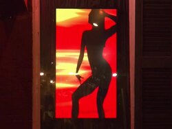 Silhoouette of exotic dancer in window on Bourbon Street in New Orleans Stock Footage