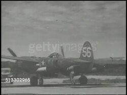 1943: LOCKHEED P-38 LIGHTNING:  VS Lockheed P-38 Lightning fighter aircraft landing on airstrip, ground crew opening hatch to K17 camera mounted in nose, retrieving film, driving away. WWII, Pacific Front, surveillance, reconnaissance, intel Instructional Video