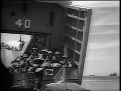 B/W 1965 truck full of US Marines driving from landing craft onto beach / Vietnam War / newsreel Stock Footage
