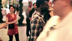 Friends walk through downtown Las Vegas with drinks in hand Stock Footage