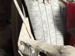 Mechanic repairing a car wheel Stock Footage