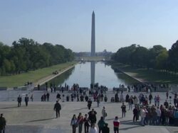 Extreme Long Shot static - Tourists visit the Washington Monument in Washington, D.C. / Washington, D.C., USA Stock Footage