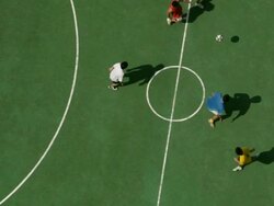 WS overhead view or  men playing football /Singapore Stock Footage