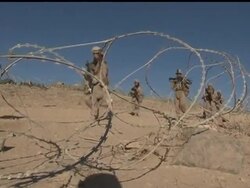 Clad in full body armour, M-16 automatic riffle in hand, the small team of US Marines readied for a foot patrol this week in one of southern Afghanistan's most hostile combat zones. News Clip