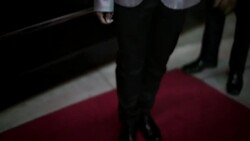 Hip young man kills time on red carpet freestyle dancing next to limousine chauffeur at awards show Stock Footage