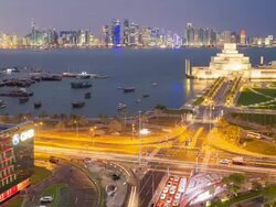 Elevated view over the Museum of Islamic Art and the Dhow harbour to the modern skyscraper skyline, Doha, Qatar, Middle East Stock Footage