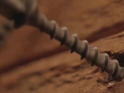 CU Shot of Screw being screwing into wood / Los Angeles, California, United States Stock Footage