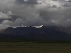 Pan left scenic view of mountains with dense clouds  Stock Footage