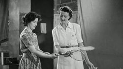 1948 Woman teaching another woman badminton / Stock Footage