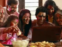 Family celebrating holi festival on the laptop Stock Footage