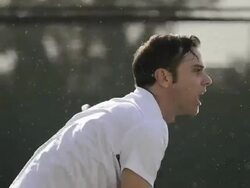CU ECU of a man serving a tennis ball and celebrating an ace serve. Stock Footage