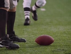 SLO MO, CU, TU, American football players tackling on field in rain, Staten Island, New York, USA Stock Footage