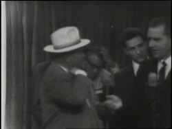 Soviet Premier Nikita Khrushchev and U.S. Vice President Richard Nixon walk through the American National Exhibit giving an impromptu television debate. News Clip