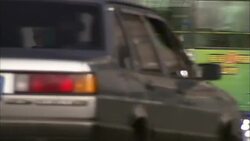 Traffic rushes past a busy street in Tibet. Stock Footage