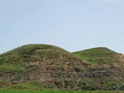 Rock formations forming a hill in the Badlands Stock Footage