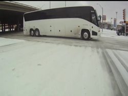 Several people were injured Friday when large chunks of melting snow and ice slid off the roof of the Cowboys Stadium.  The wintry weather is also sacking Super Bowl business for many Dallas merchants. News Clip