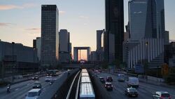 Paris road leading towards La Grand Arche and modern office buildings at La Defense, Paris, France Stock Footage