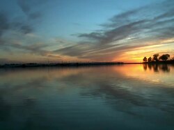 Sky Reflecting off Water at Sunset Stock Footage