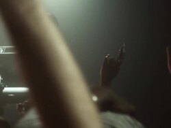 SLO MO woman DJ in crowded nightclub, crowd waving hands in air / New York, New York Stock Footage