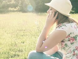 girl in nature talking on the phone Stock Footage