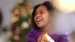 Young girl watches and laughs as father tosses cookie dough into the air Stock Footage