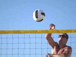 A man spiking a beach volleyball. - Slow Motion - filmed at 240 fps Stock Footage