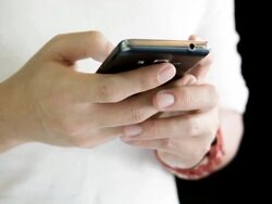 Young man using smartphone. Stock Footage