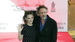 Tim Burton and Winona Ryder at the Tim Burton To Place Handprints-Footprints In Cement At TCL Chinese Theatre IMAXï¿½ Forecourt Stock Footage