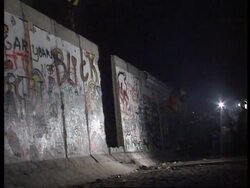 Gedaechtniskirche, Section Of Wall Destroyed, West German Soldiers, Flowers In Fence News Clip