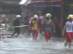 Rescue Team Walks Through Storm Surge Flooding After Typhoon Haiyan Stock Footage