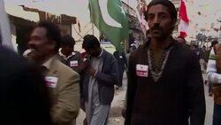 CLEAN : Pakistanis protesting Charlie Hebdo burn French flags News Clip