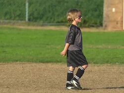 Boys ages 6 to 8 playing in a youth soccer league game. - Slow Motion Stock Footage
