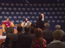 MS Man handing microphone to woman in audience at World Economic Forum AUDIO / Davos, Graubunden, Switzerland Stock Footage