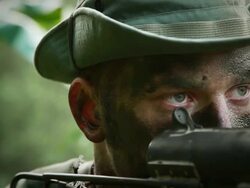 CU R/F U.S. Special Operation Forces rifleman with submachine gun in Vietnam war / Jungle, Hue, Vietnam Stock Footage