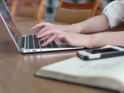 unrecognizable female student using laptop in library,real time. Stock Footage