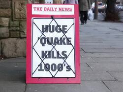 Newspaper headline Board - Huge Earthquake kills thousands Stock Footage