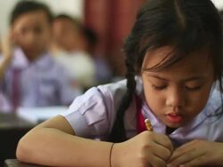 CU SLO MO Little sitting in class and  writing / Vientiane, Laos Stock Footage