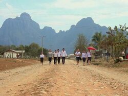 WS Children with school dress walking on road /  Vang Vieng, Vientiane, Laos Stock Footage